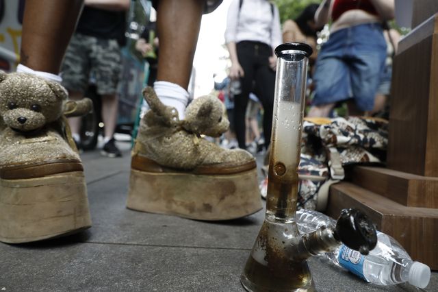 A bong used to smoke marijuana sits at the foot of the podium as New York City mayoral candidate Paperboy The Prince speaks and sings to a group near City Hall on June 6, 2021.